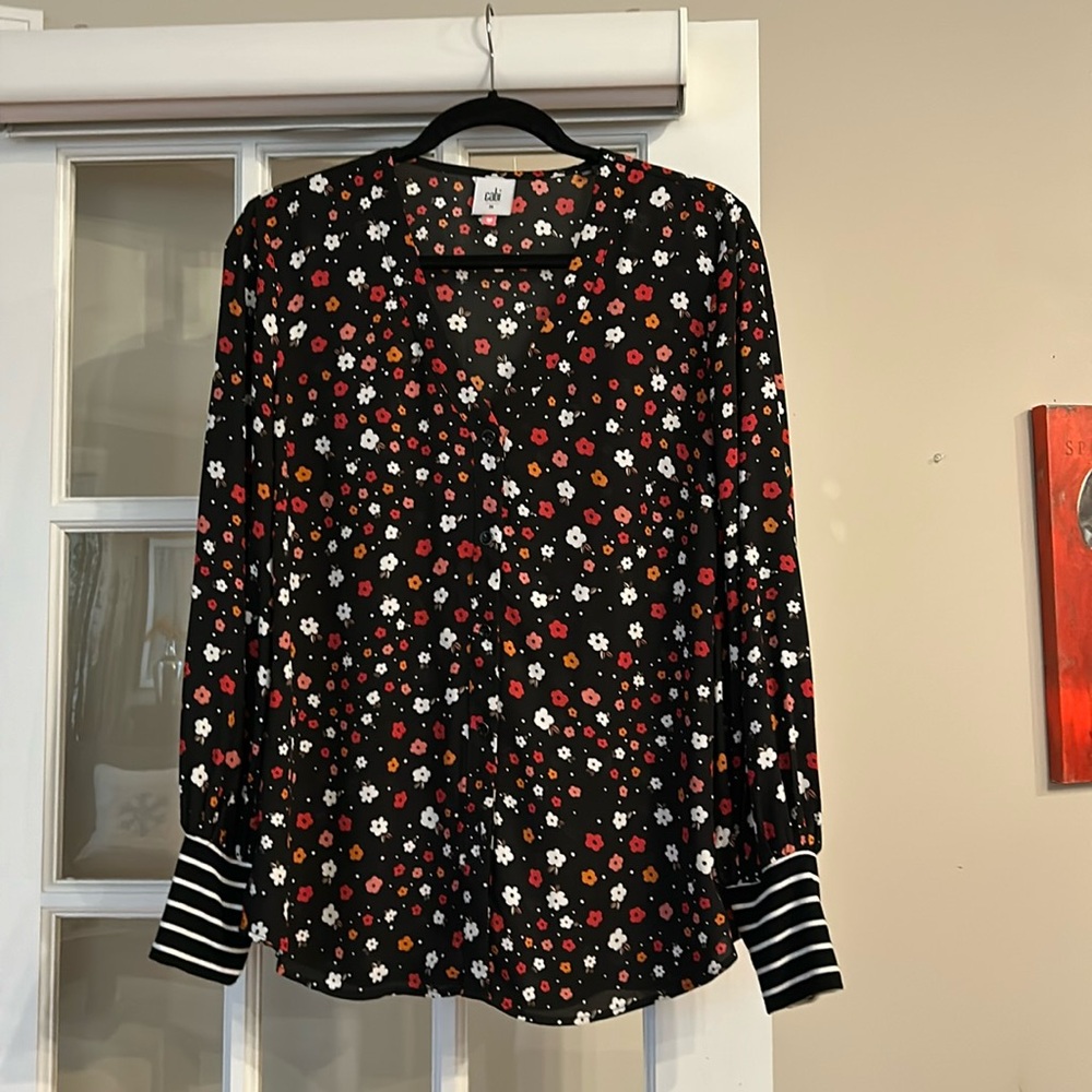 Beautiful Cabi blouse with fun cuffs and striking colors of little flowers